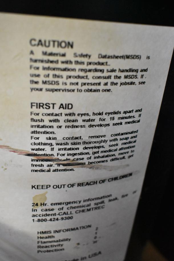 Label on Pro Guard Chemicals container, includes caution, first aid instructions, and emergency contact for safe handling.