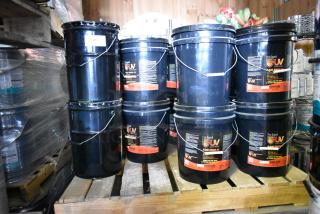 21 containers of Pro Guard Flash Finish UV Clear Gloss, 5-gallon size, new, labeled with product details.