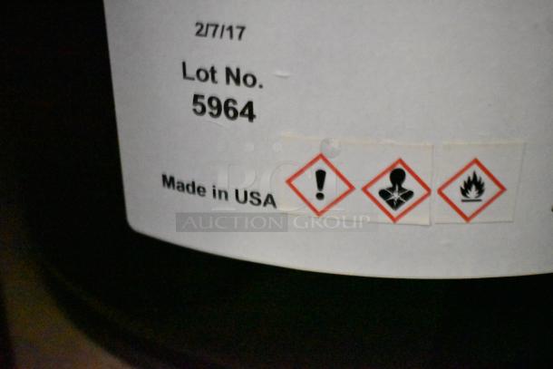 12 Pro Guard chemicals, 5-gallon 2114 Moisture Cure Primer, clear blue, Lot No. 5964, made in USA, hazard symbols visible.