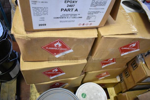 Nine boxes of Pro Guard chemicals, including 2407 Part A Epoxy. Each box marked as flammable liquid.