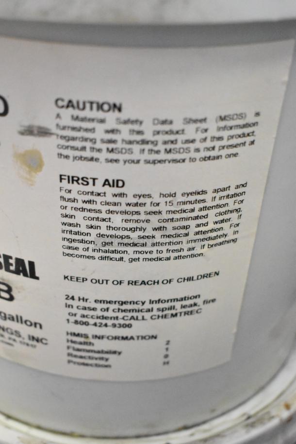 Seven Pro Guard chemical containers, including a 2-gallon 9908 EPDM Super Pipe Seal Part B. Visible first aid instructions.