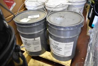2 Pro Guard 5-gallon pails of 9108 Moisture Cure Dark Gray Liquid Rubber, labels visible, on wooden pallet.