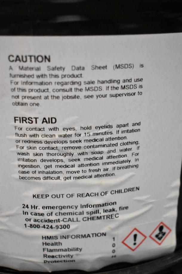 Label on chemical container showing first aid instructions and emergency contact information for Pro Guard Chemicals.