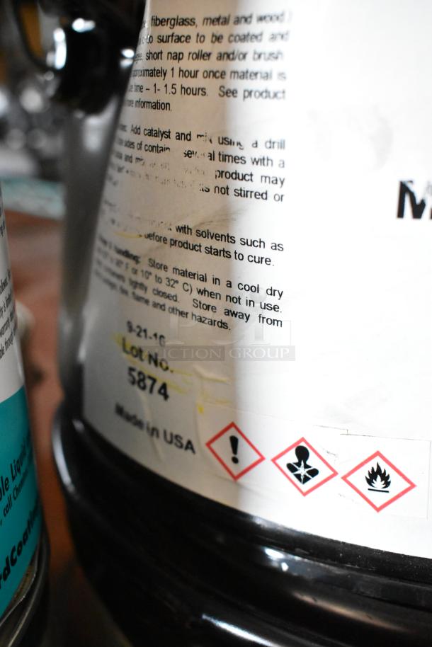 Container of Pro Guard Chemicals with safety labels and lot number 5874, Made in USA, visible text on application instructions.