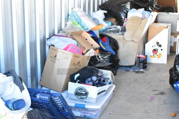 Storage unit #77 with stroller, children's furniture/toys, vintage popcorn cart, Everlast punching bag, tire, and more.