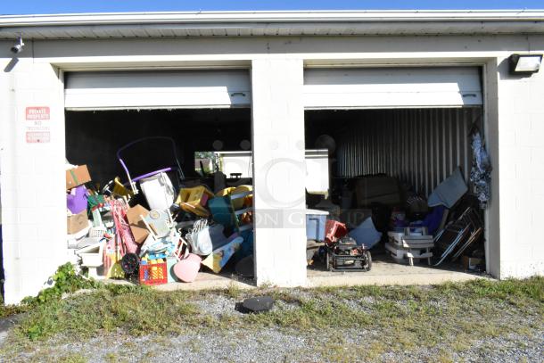 Storage unit #77 contents including stroller, children’s furniture, popcorn cart, Everlast punching bag, tire, rocking chair, lawnmower.