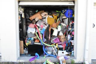 Storage unit contents including mini cooler, Sony TV, children's toys, and baskets. Requires cleaning deposit refund.
