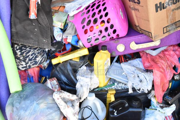 Storage unit contents include mini cooler, Sony TV, toys, baskets, and miscellaneous items in various conditions.