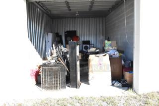 Contents of Storage Unit #60, including a portable grill, trash can, weight plates, games, Bunn coffee machines, and chairs.
