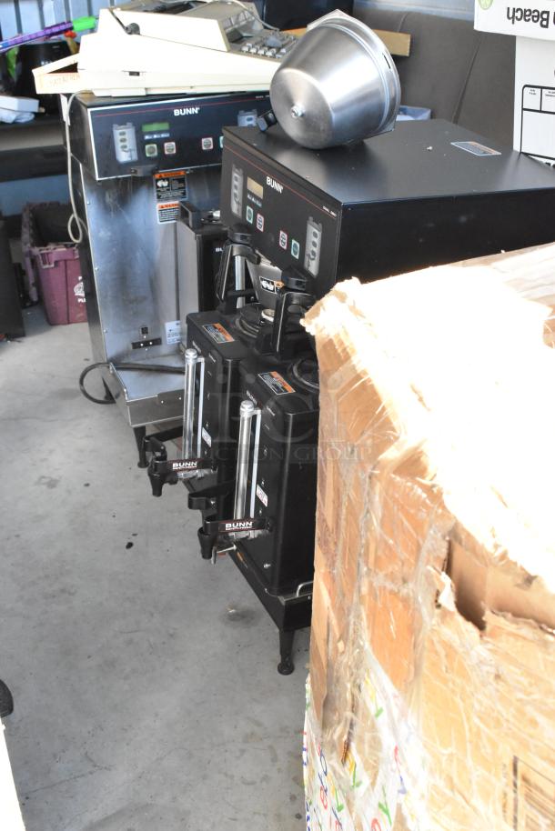 Bunn coffee machines and a large cardboard box inside storage unit, part of auction lot #60 contents.