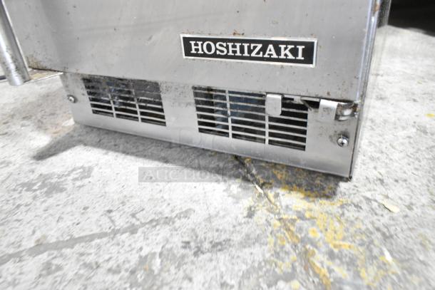 2019 Hoshizaki HR15A stainless steel commercial ice machine, 115V, self-contained. Visible wear on exterior.
