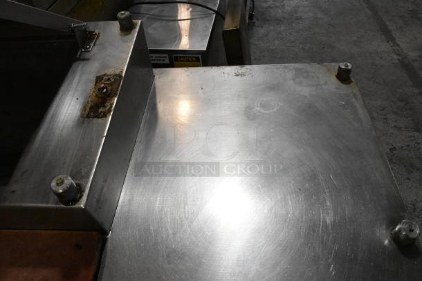 Delfield MKV9885751 stainless steel pizza prep table, oversized cutting board, visible wear, 2 doors, 2 drawers.