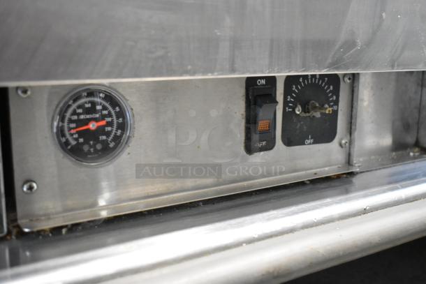 CresCor EB150 heated holding cabinet controls; features thermostat dial and power switch. Stainless steel build with commercial casters.