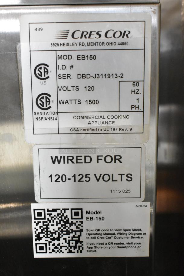 CresCor EB150 stainless steel heated cabinet with commercial casters, 120 volts, 1 phase. Labels show model and serial number.