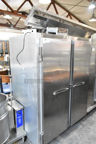 Continental 2R stainless steel commercial 2-door reach-in cooler, features commercial casters, 115V, 1 phase, in good condition.