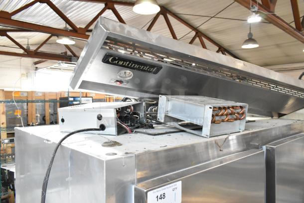 Continental 2R stainless steel commercial 2-door reach-in cooler on casters. Visible wiring and ventilation on top. 115V, 1 Phase.