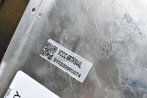 XCCC 6R7K844L evaporator coil with visible barcode and serial number 010220080074 on metallic surface.