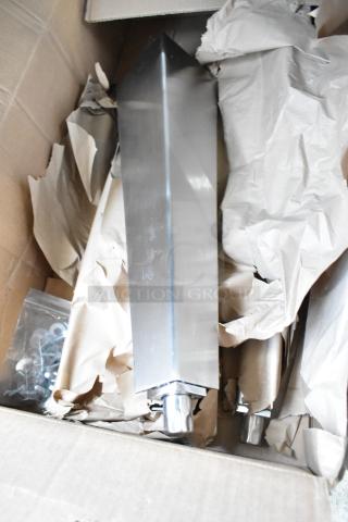 Box of brand new metal legs, model 1951204-0003, for convection oven. Includes hardware, wrapped in paper for protection.