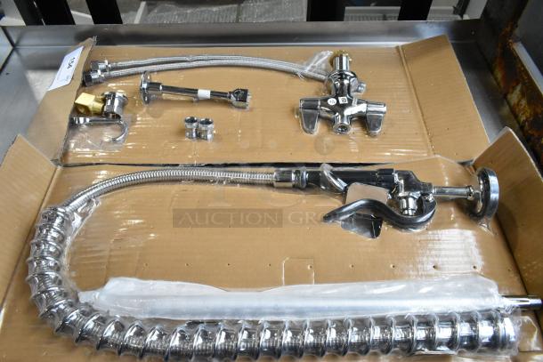 Brand new scratch and dent spray nozzle attachment, chrome finish, flexible hose, adjustment fittings included, boxed.