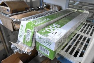 2 new 12224X5HD 24"x500' heavy-duty aluminum foil rolls, slight dents, original packaging, auction tag visible.