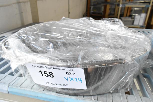 24 brand new scratch and dent metal baking pans, wrapped in plastic, labeled "1508," starting bid multiplies 24 times.