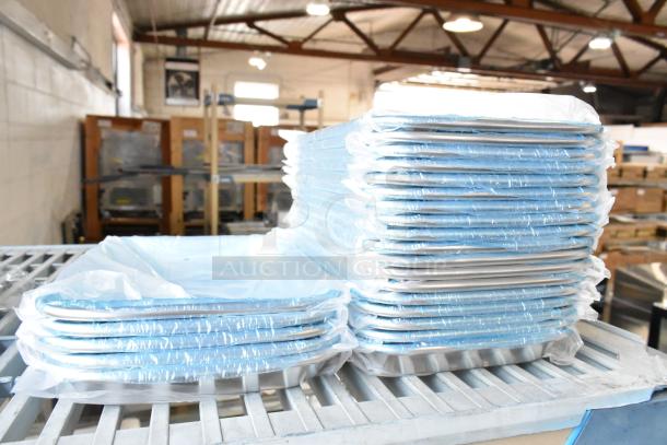 Stack of 24 brand new metal baking pans, model 1508. Scratch and dent items, wrapped in blue protective plastic.