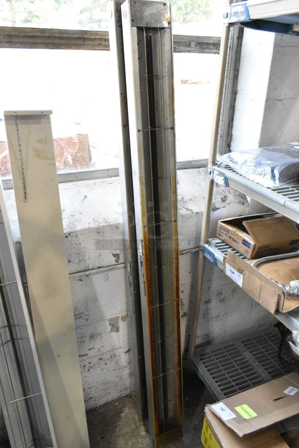 2 Hatco GRAH-72 metal heat strip warmers, 120 volts, 1 phase. Metal shows signs of wear. Stored upright near shelves.