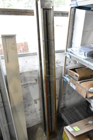 2 Hatco GRAH-72 metal heat strip warmers, 120 volts, 1 phase. Metal shows signs of wear. Stored upright near shelves.