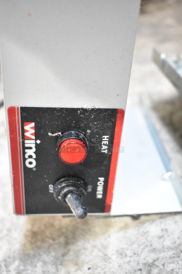 Winco ESH-60 metal heat strip warmer, 120 volts, 1 phase, with red heat control knob and power toggle switch.