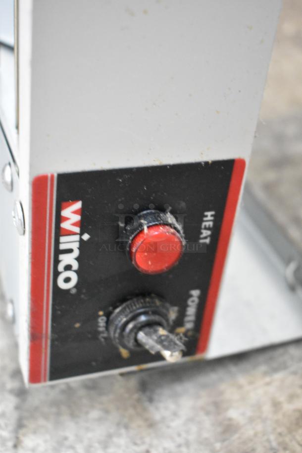 Winco ESH-60 metal heat strip warmer, 120 volts, 1 phase; red heat knob; durability visible.