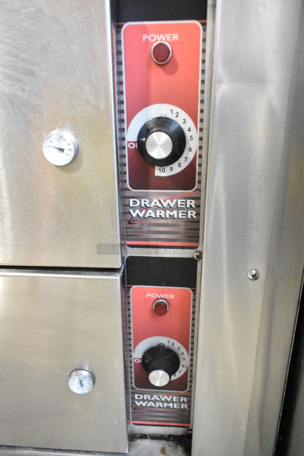Stainless steel work station with Delfield 8146N cooler, 2 drawer warmers, over shelf, and Hatco food strip warmer controls.