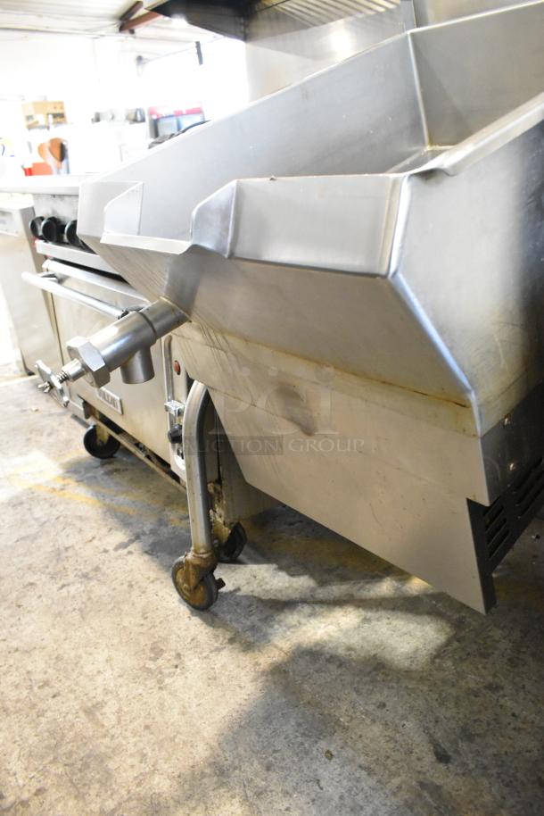 Cleveland stainless steel commercial tilting braising pan with casters, floor style, used condition, ideal for professional kitchens.