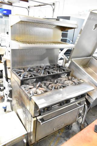 Vulcan stainless steel commercial gas range with 6 burners, convection oven, 2-tier overshelf, backsplash, on casters.
