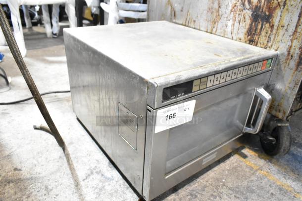 Panasonic stainless steel commercial countertop microwave oven with numerical keypad. Visible wear and auction tag label 166.