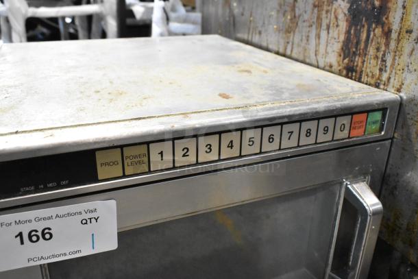 Panasonic stainless steel commercial countertop microwave oven, keypad controls visible, showing wear, auction tag number 166.