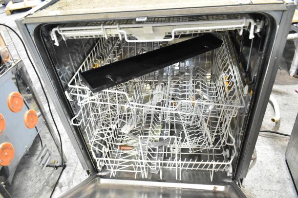Miele G2432SCU stainless steel undercounter dishwasher, open view of interior racks, used condition. 115 volts, 1 phase.