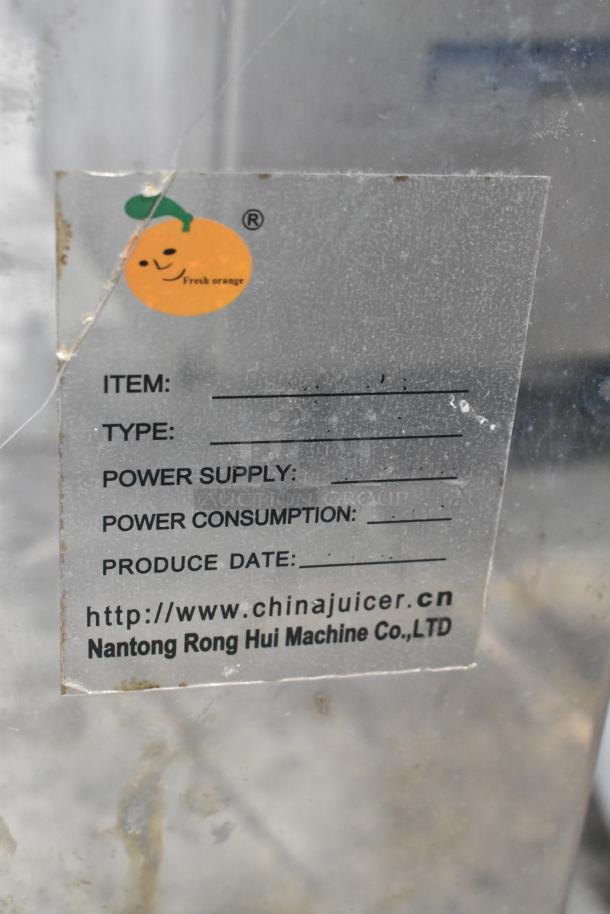 Metal commercial countertop citrus juicer with visible label. Includes spare parts. 115 volts, 1 phase.