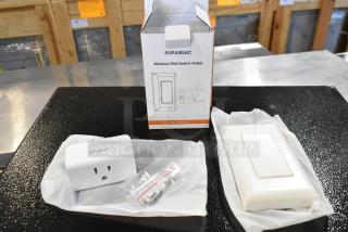 Suraielec Wireless Wall Switch Outlet, brand new in box, with outlet, switch, and mounting hardware visible.