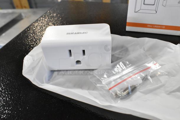Brand new Suraielec wireless wall switch outlet with mounting screws, displayed on packaging. Model SKU: URSW11D.