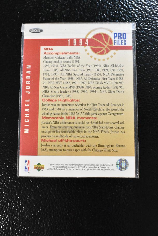 Signed 1994 Pro Files Collector's Choice Michael Jordan golf card, detailed achievements listed, in pristine condition.