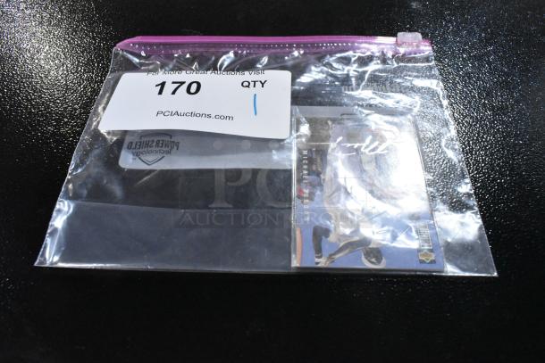 Signed 1994 Collector's Choice Michael Jordan golf card in protective sleeve, includes visible signature; inside labeled bag.
