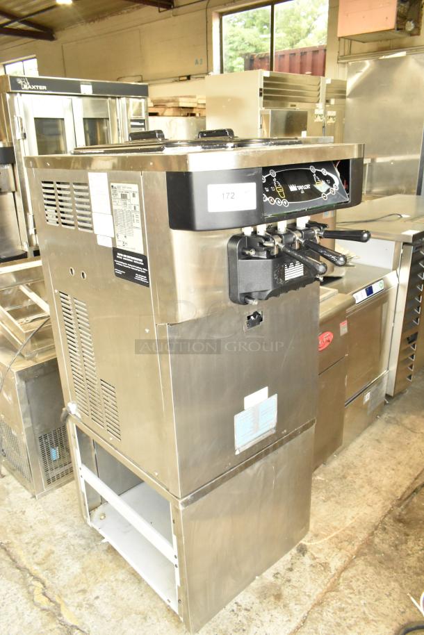 Taylor stainless steel 2-flavor soft serve ice cream machine with twist option on commercial casters. 208-230 volts, 1 phase.