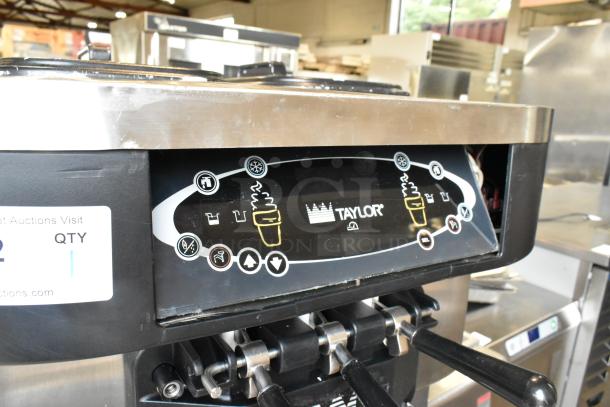 Taylor stainless steel 2-flavor soft serve ice cream machine with twist. Commercial casters, 208-230V, 1 phase.