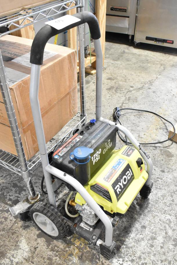 Ryobi 1700 PSI 1.2 GPM electric pressure washer on wheels, featuring durable frame, soap tank, and power cord.