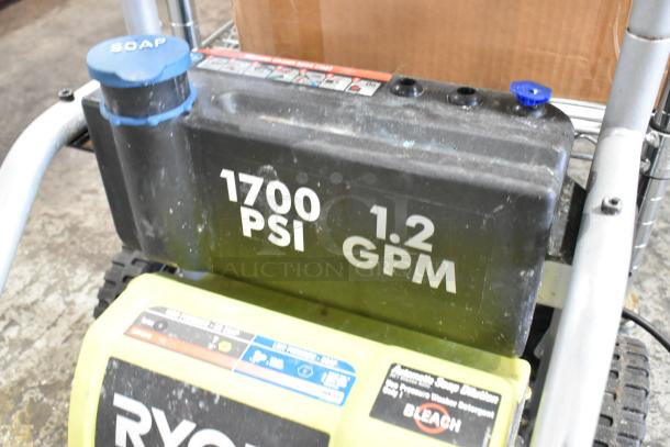 Ryobi 1700 PSI 1.2 GPM Electric Pressure Washer, soap container visible, used condition, model details on side.