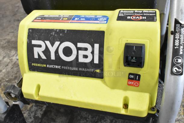 Ryobi 1700 PSI 1.2 GPM Electric Pressure Washer, yellow casing, premium label, on/off switch visible, fair condition.