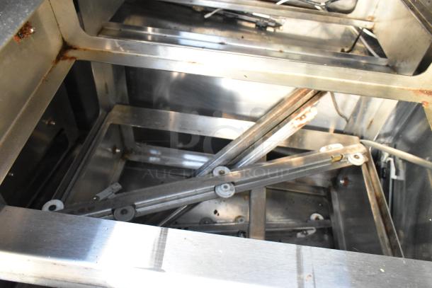 Norlake UR72 undercounter cooler interior, showing stainless steel structure, mild rust, and metal components.