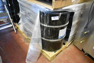 4 Gray Liquid Rubber 55-gallon barrels on pallet, Pro Guard brand, labeled for auction, in good condition.