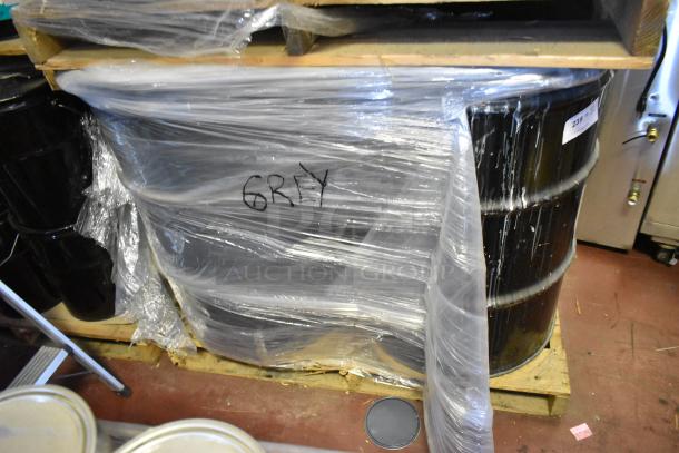 4 Pro Guard gray liquid rubber barrels, 55 gallons each, wrapped in plastic. Includes labeling "GRAY."