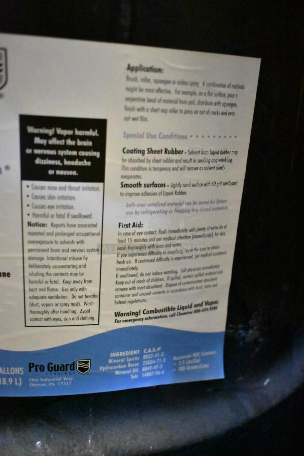 Four 55-gallon Pro Guard Gray Liquid Rubber barrels with application instructions. Safe storage detailed. Combustible warning.